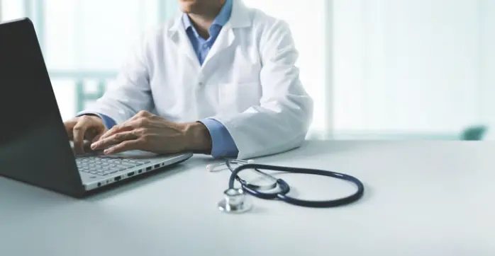 Image of physician using laptop